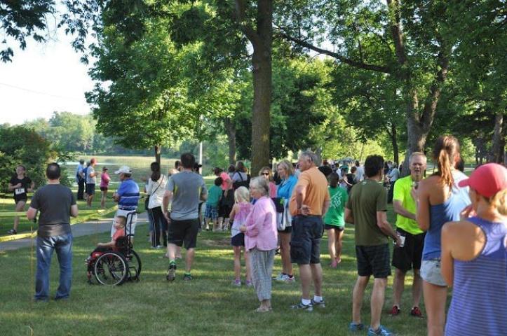 Dozens of spectators gathered near the finish line to cheer on the 149 participants in the Watercade Lake Ripley Run on July 9.