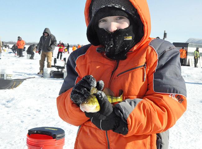 Landon Pederson, 7, named this fish Fatty after catching it at the Wintercade ice fishing tournament.