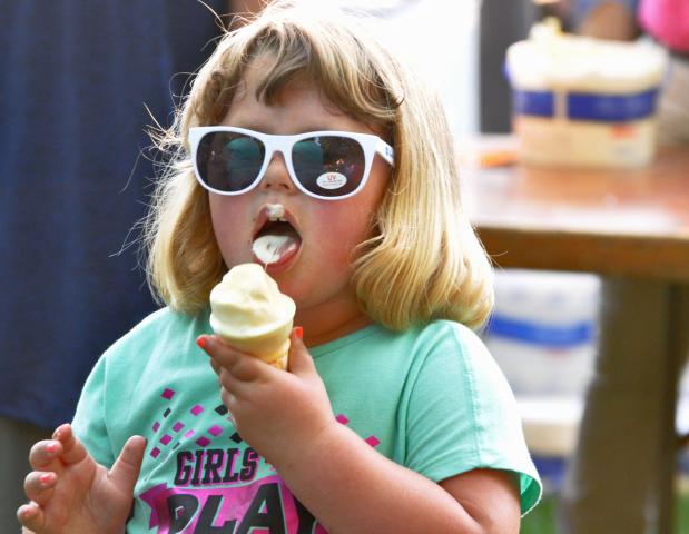 Sporting her new shades, Samantha Kaley, 4, of Litchfield enjoyed an ice cream cone in Central Park during Litchfield Watercade.