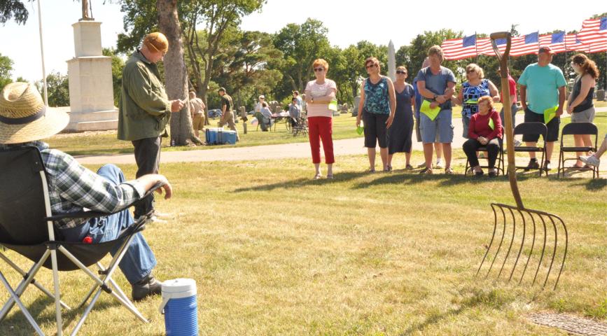 Jim Swenson portrayed Frank Valine, a World War I aviator, during a tour of  Lake Ripley Cemetery July 7.