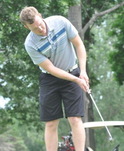 Jeremy Berger of Litchfield rolled in a birdie putt at the Watercade golf scramble Sunday at Litchfield Golf Club. His team with the Cziok couple shot a one-under-par 34.  Staff photo by Mike Randleman