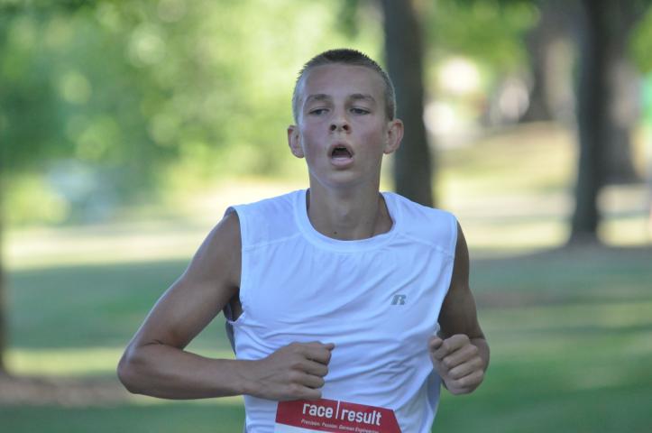 Ben Ammermann, 15, of Litchfield crossed the line in 23:01.84 to win the Watercade four-mile race Saturday.