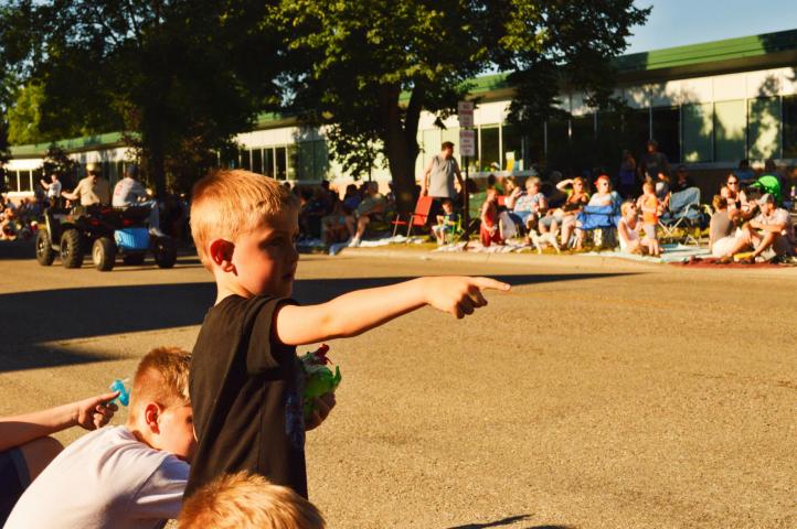 Bennett Kettner, 4, pointed at passing tractors during the Grand Day Parade in Litchfield Saturday evening.
