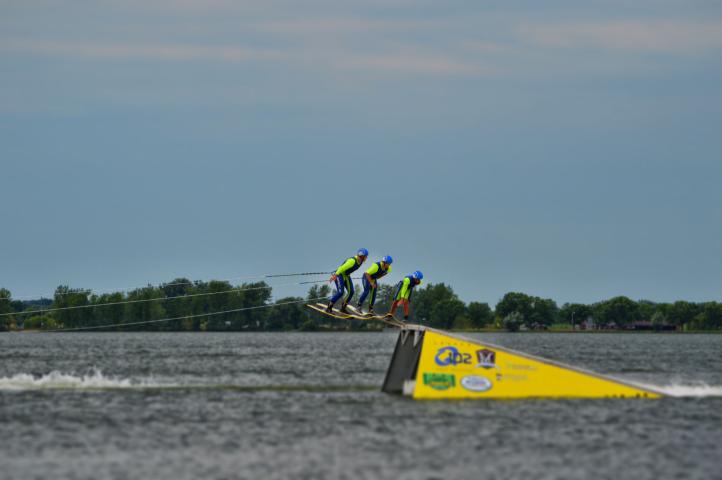 Three members of the Little Crow Ski Team performed a triple helicopter jump on Lake Ripley Sunday.