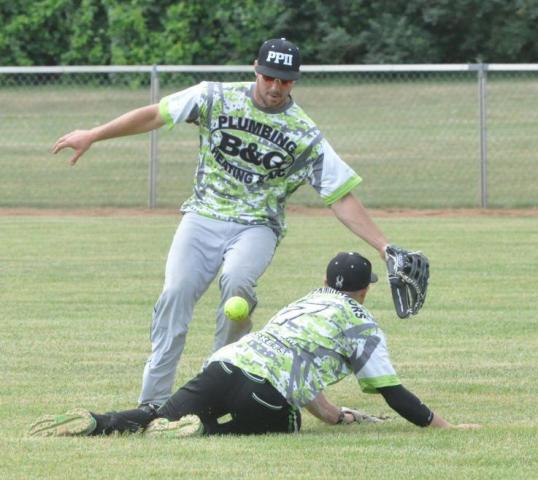 A pair of B&amp;G Plumbing, Heating &amp; AC/Pest Pro II defenders avoided collision at the Watercade softball tournament.