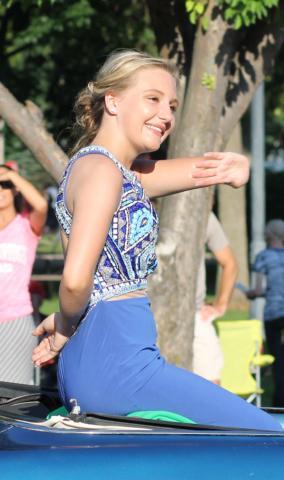 Candidate Shelby Nelson, who later won the formal gown award, made her way through Litchfield during Saturday’s parade.