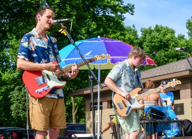 Alec John and The Sky Surfers perform at the KLFD Beach Party at Lake Ripley Friday afternoon.