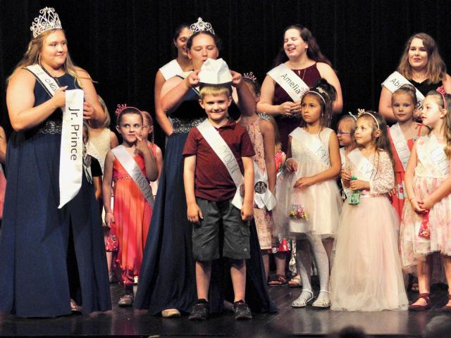 Hayden Miller, 7, receives his "crown" — a sailor's hat — during as the 2019 Junior Prince. Crowning Miller is Princess Laura Shoutz, and waiting to give him his sash is Miss Litchfield Brianna Larson.