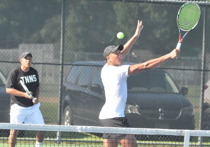 Jesse Brace, front, and father Barry Brace teamed up to win the men’s open doubles title at the Watercade tennis tournament.