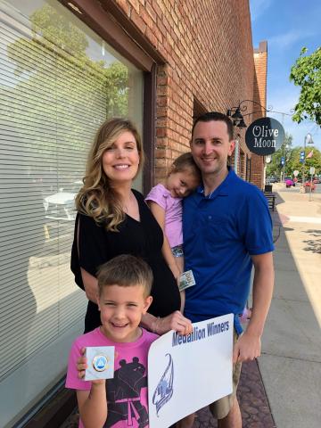 Prior Lake’s Schreck family — parents Cali and Dan and kids Cameron and Everly — won the $200 prize after finding the Lakefront Days medallion in the festival’s annual contest.  Submitted photo