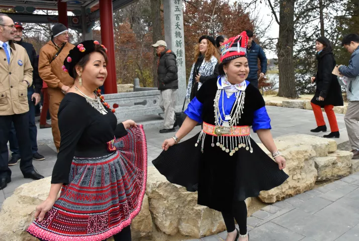 Women wearing traditional Hmong dresses pose Saturday, Nov. 3, 2018, in front of the new Xiang Jiang Pavilion, a gift from St. Paul's sister city Changsha in China. The pavilion is the first phase of a 1.2 acre China garden in Phalen Park. (Deanna Weniger / Pioneer Press)