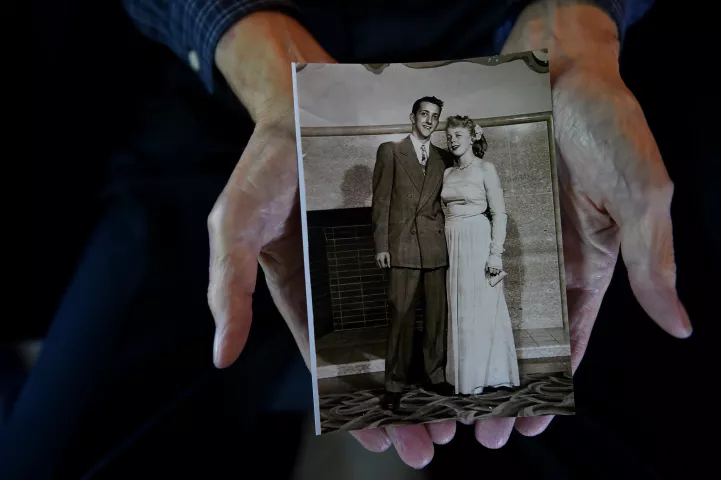 Bob Momsen holds a photo of himself and his bride, Yvonne, taken at a spring formal about six months before their wedding in 1948, at his Mendota Heights home on Friday, Sept. 7, 2018. The couple will celebrate their 70th wedding anniversary on Sept. 11, 2018. (Jean Pieri / Pioneer Press)