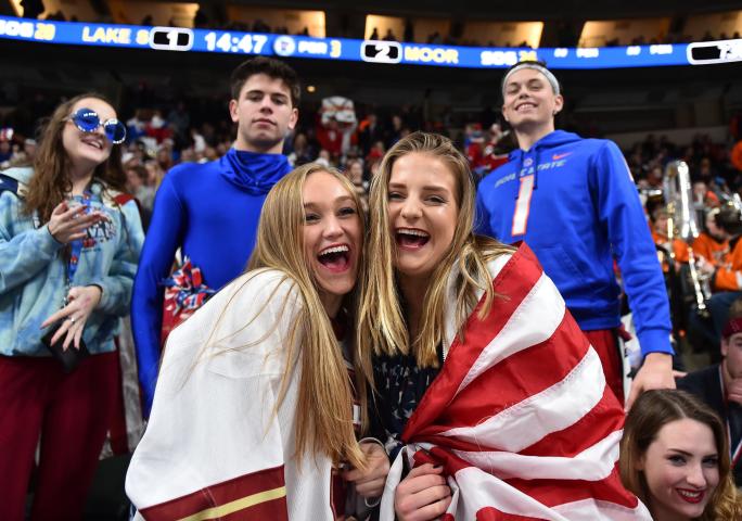 A pair of patriotic Lakeville South Cougars fans cheer as their team takes on the Moorhead Spuds in the second period in a Class 2A semifinal game of the Minnesota State High School Boys Hockey Tournament at Xcel Energy Center in St. Paul on Friday March 10, 2017. (Special to the Pioneer Press: John Autey)