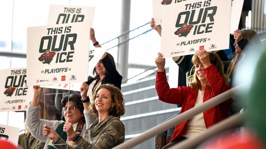 Fans lift their signs at a Minnesota Wild Stanley Cup Playoffs Pep Rally at TRIA Rink in St. Paul on Wednesday, April 11, 2018. (Jean Pieri / Pioneer Press)