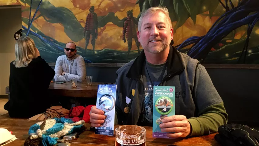 With his St. Paul Winter Carnival buttons on display, John Collins, winner of the 2019 Pioneer Press Treasure Hunt, takes a break from this years Love Your Melon Presents Pioneer Press Treasure Hunt during the Pioneer Press Treasure Hunt Beer release at the Bad Weather Brewing Company in St. Paul on Saturday, Jan. 18, 2020. (Molly Guthrey / Pioneer Press)