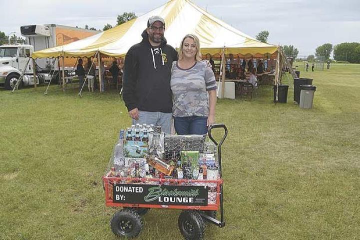 A resident from Ramsey held the winning raffle ticket for the wagon load of booze donated by Blacksmith Lounge. Whitney Cobb bought two tickets from the Lions at the suggestion of her husband Kyle.
