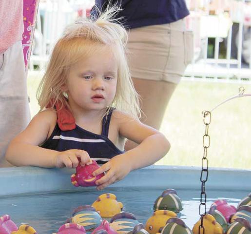 Two-year-old Austin, of Hugo, checks out all of the fish.