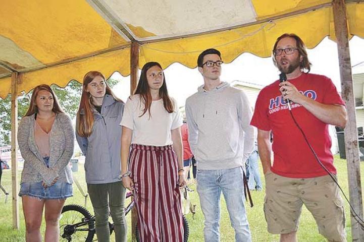 Lion Grant Shaffer, right, announced this year’s scholarship winners. Coincidently all attended Oneka Elementary and White Bear Area High School. From left, Kelly Elletson, who plans to study nursing at Century College; Maren Viker, attending George Washington University for political science; Paige Gregoire, attending UW-River Falls for teaching and Zach Weslaski, attending UW-LaCrosse to become a physician’s assistant. Not pictured, Jessica Crosson, attending University of St. Thomas for pathology.