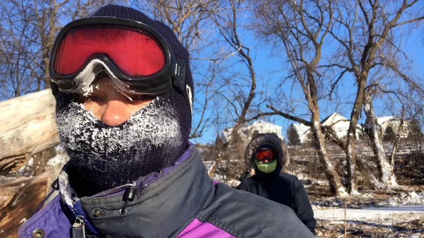 Jane Heinks, left, and her daughter Mary Heinks take a break from digging for the Pioneer Press Treasure Hunt medallion at Long Lake Regional Park in New Brighton on Wednesday afternoon, Jan. 30, 2019, hours before the final clue is posted online. Some 200 people were enjoying lighter winds and sunshine, despite the fierce cold, at the park at midafternoon. The Heinkses live across the lake from the park and decided to jump into the hunt because they know the park so well and live so close. (Lisa Legge / Pi