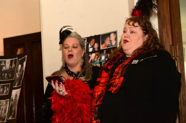 Kathy Rustin, left, and Paula Berends sing “How Great Thou Art” on Monday, Feb. 4, 2019, at the funeral of long-time Winter Carnival volunteer June Lacey in St. Paul. Lacey died at age 89 just as the 2019 Winter Carnival was beginning. Rustin was the 2014 Klondike Kate and Berends the 2005 Klondike Kate. (Scott Takushi / Pioneer Press)
