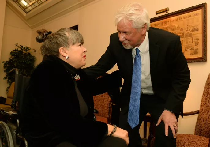Dan Stoltz, King Boreas LXXIX in 2015, gives his condolences to Joyce Lacey, at the funeral of long-time Winter Carnival volunteer June Lacey, who died at age 89 just as the 2019 Winter Carnival was beginning, in St. Paul, Feb. 4, 2019. Joyce, the daughter of June, was also Aurora, Queen of the Snows in 1994. (Scott Takushi / Pioneer Press)