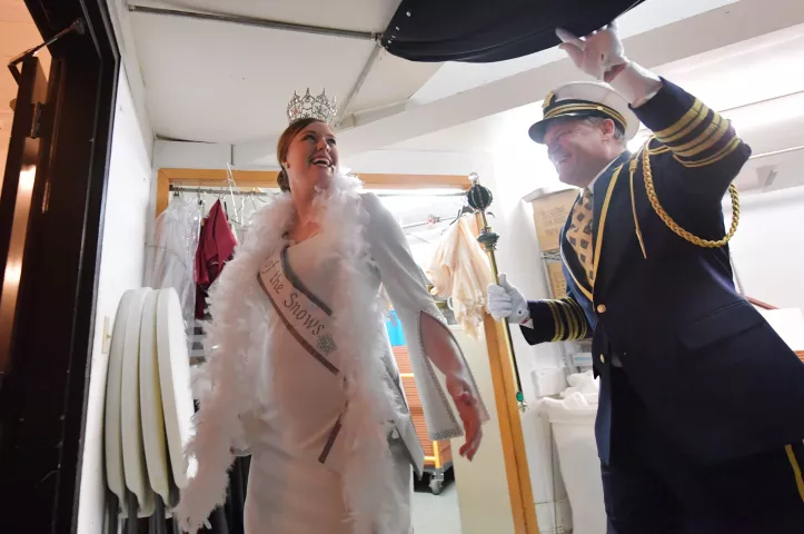 The 2019 St. Paul Winter Carnival’s King Boreas Monte Johnson holds a curtain for Aurora, Queen of Snows Alison Gunter as they are introduced to the audience during the Klondike Kate contest at the enVision hotel in South St. Paul on Wednesday, Jan., 8, 2020. (John Autey / Pioneer Press)