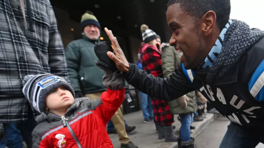 Mason Parah, 5, from Woodbury, gets a high five from St. Paul Mayor Melvin Carter III during the 2020 St. Paul Winter Carnival King Boreas Grand Day Parade in downtown St. Paul on Saturday, Jan. 25, 2020. (John Autey / Pioneer Press)