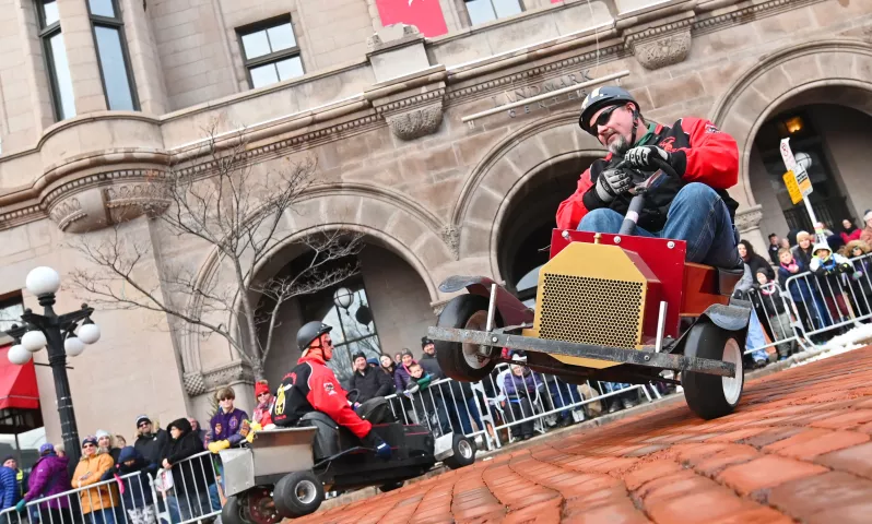 Drivers with the Osman Shiners Go Cart team perform during the 2020 St. Paul Winter Carnival King Boreas Grand Day Parade in downtown St. Paul on Saturday, Jan. 25, 2020. (John Autey / Pioneer Press)