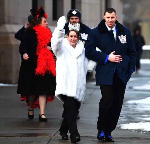 Kirstin Knutson, Queen of Snows of the 2020 St. Paul Winter Carnival and Daniel Maslowski, a Royal Guard, cross the street from the Landmark Center to Rice Park in St. Paul Friday, Jan. 31, 2020. Maslowski proposed Thursday night to Knutson in Rice Park. (Jean Pieri / Pioneer Press)