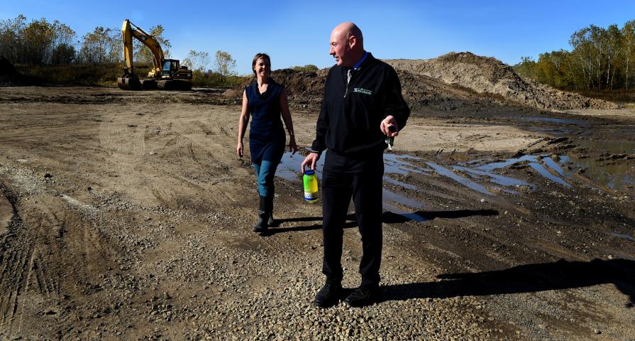 Mike Hahm, St. Paul Parks and Recreation director, right, and Angie Tillges, from Great River Passage Initiative in the parking lot of Pig's Eye Regional Park in St. Paul Thursday, Oct. 19, 2017. (Jean Pieri / Pioneer Press)