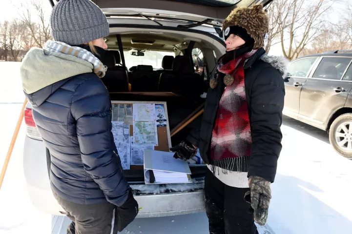 "A girl's gonna find it this year," said Rebecca Howell Gibson, right, of Forest Lake, as she talks with Brenda Cunningham, of White Bear Lake, before she sets out searching for the 2019 Pioneer Press Treasure Hunt medallion in Long Lake Regional Park in New Brighton Thursday, Jan. 24, 2019. The women, who met yesterday, study maps in Gibson's trunk. (Jean Pieri / Pioneer Press)
