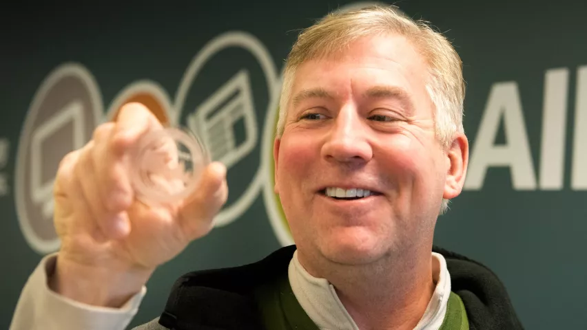 John Collins of Fridley smiles while holding the 2019 Pioneer Press Treasure Hunt medallion on Thursday, Jan. 31, 2019. Collins, a lifelong medallion hunter, found the treasure Wednesday night at Long Lake Regional Park in New Brighton. (Andy Rathbun / Pioneer Press)