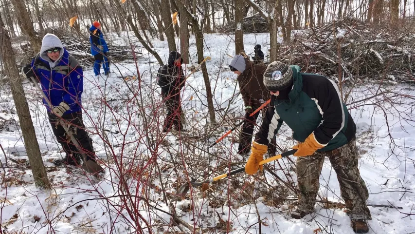 Pioneer Press Treasure Hunt buddies dig at Long Lake Regional Park on Monday, Jan. 28, 2019, for the prized medallion. From left, are Scott Nelson of Lindstrom, Alicia Mertz of Woodbury, Kelli Kamholz of South St. Paul, and a guy who goes only by "Smitty," of St. Paul. Nelson was looking on the bright side Monday: "At least we didn't get 10 inches of snow." (Lisa Legge / Pioneer Press.)