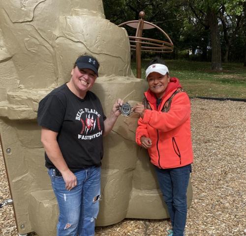 Angie Johnson and Ann Miller found the 2020 Harvest Fall Medallion under a stone in Riverview Park, on Thursday, Oct. 1.