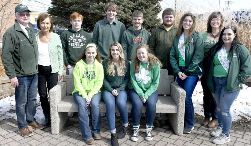 (Back from left) St. Patrick's Day Grand Marshals T.C. and Carol Fogarty, Luke Fogarty, Lucas O'Brien, Collin Fahey, Will Fahey, 2019 First Princess Alyson Dvorak, emcee Kate Fogarty, and 2019 Second Princess Courtney Maher stopped for a photo with the 2020 Miss Shamrock candidates (seated) Cassandra Leeper, Hayley O'Brien and Brooke McGlinchey.