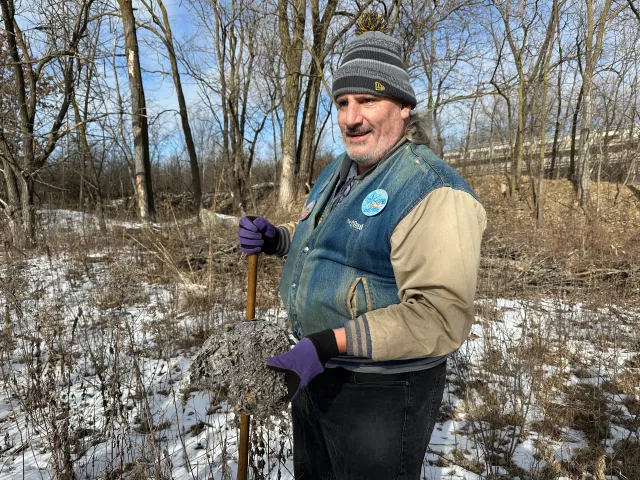 Brad TeGantvoort, known to friends as “Cluey,” holds up a wasp nest that does not contain a hidden medallion during the Pioneer Press treasure hunt on Jan. 25, 2025, in Roseville’s Central Park. TeGantvoort, a respected longtime hunter, died Dec. 8, 2025. (Courtesy of Jason Michaelson)