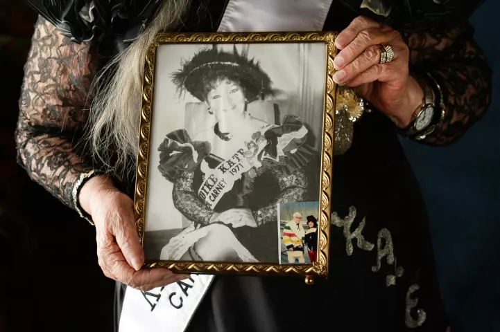 Carol Carney holds a 1971 photo of herself from the year she was the first St. Paul Winter Carnival’s Klondike Kate, photographed 50 years later on Wednesday, Jan. 20, 2021 at her home in Lindstrom. Note the snapshot of Carney with Col. Sanders in the lower right corner. (Scott Takushi / Pioneer Press)