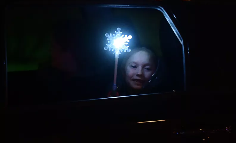 Ava Schneipp of Minneapolis waves her wand at the St. Paul Winter Carnival Drive-Thru Ice and Snow Sculpture Park on the Minnesota State Fairgrounds in Falcon Heights on Thursday, Jan. 28, 2021. (John Autey / Pioneer Press)
