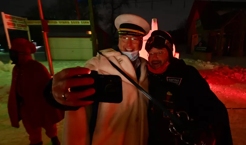 Boreas Rex LXVIII, John Bennett, left, and Vulcanus Rex LXVII, Steve Lydon, take a selfie at the St. Paul Winter Carnival Drive-Thru Ice and Snow Sculpture Park on the Minnesota State Fairgrounds in Falcon Heights on Thursday, Jan. 28, 2021. (John Autey / Pioneer Press)