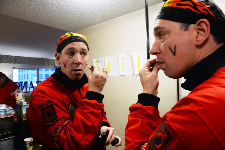 Count of Ashes Michael Daleiden draws the Vulcan "V" on his face before a photo shoot with the 2022 Vulcan Krewe in St. Paul, Wednesday, Feb.2, 2022. (Scott Takushi / Pioneer Press)