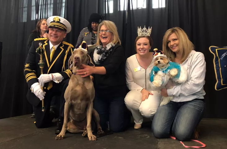 The 2019 King Boreas, Monte S. Johnson, poses with Gunnar, the Canine King Boreas (left) while the 2019 Queen of the Snows, Alison Gunter, poses with Maddie, the Canine Queen of the Snows, and the dogs’ people, on Saturday, Feb. 2, 2019, after crowning the dogs at the Doggie Depot event at Union Depot in Lowertown, St. Paul. (Courtesy of Union Depot)