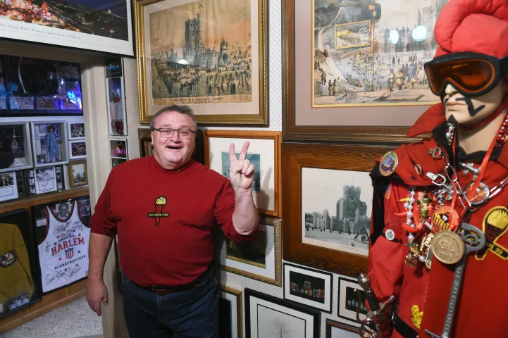 Tom Barrett flashes the Vulcan "V" as he shows off a portion of his collection of Winter Carnival memorabilia in the basement of his home on Wednesday, Jan. 12, 2022. Since the 1990s, Barrett has been one of the key players who make the St. Paul Winter Carnival happen. In 2004, Barrett led his own Vulcan Krewe as the Fire King, Vulcanus Rex LXVII. He is in charge of both Winter Carnival parades this year and a collector of all things related to the history of the Carnival. (Scott Takushi / Pioneer Press)