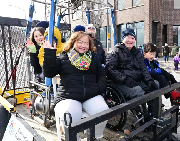 The family of Olympic Gold Medalist gymnast Suni Lee waves to the crowd as the Community Grand Marshal of 2022 King Boreas Grande Day Parade, Presented by Hamernick’s, along West 7th Street in St. Paul on Saturday, January 29, 2022. (John Autey / Pioneer Press)