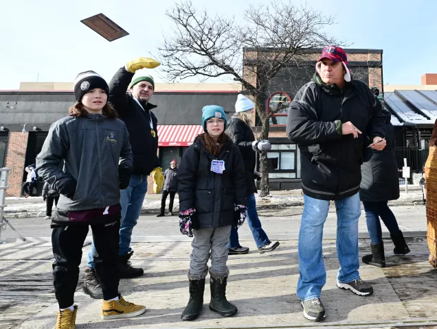 Grand Marshalls Neal Broten, rear left, and Kent Hrbek, center, along with their families, play to the crowd during 2022 King Boreas Grande Day Parade, Presented by Hamernick’s, along West 7th Street in St. Paul on Saturday, January 29, 2022. (John Autey / Pioneer Press)