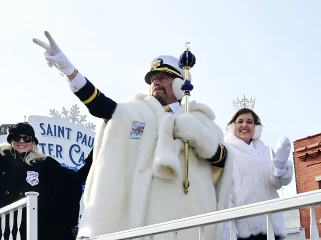 King Boreas LXXXIV, Billy Given, and Aurora, Queen of Snows, Effie Barnes, wave to the crowd during the 2022 King Boreas Grande Day Parade, Presented by Hamernick’s, along West 7th Street in St. Paul on Saturday, January 29, 2022. (John Autey / Pioneer Press)