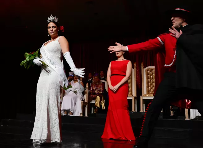 Notos, Prince of the South Wind, Joey Clark, spotlights South Wind Princess, Cathryn Heimerdinger, during the 2022 St. Paul Winter Carnival Royal Coronation at the Saint Paul RiverCentre on Friday, January 28, 2022. (John Autey / Pioneer Press)