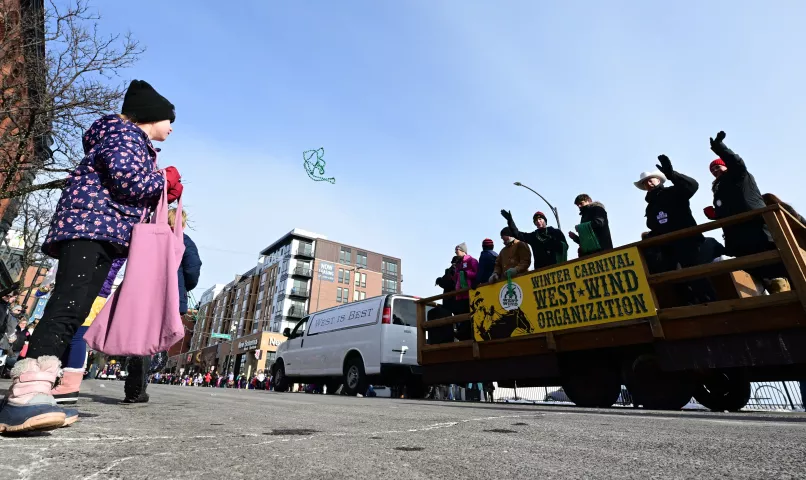 Brigid Baker, 6 1/4 years-old, from Eagan watches as a string of beads is tossed her way during the 2022 King Boreas Grande Day Parade, Presented by Hamernick’s, along West 7th Street in St. Paul on Saturday, January 29, 2022. (John Autey / Pioneer Press)