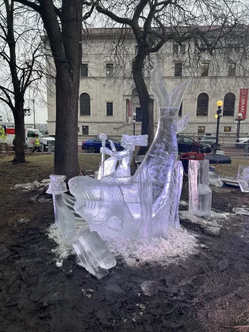 "Shark with Mermaid," an ice sculpture by Terry Reis, Rob Graham and AJ Edwards won third place in the multi-block category in the 2023 St. Paul Winter Carnival Ice Carving Competition. (Courtesy of St. Paul Winter Carnival)