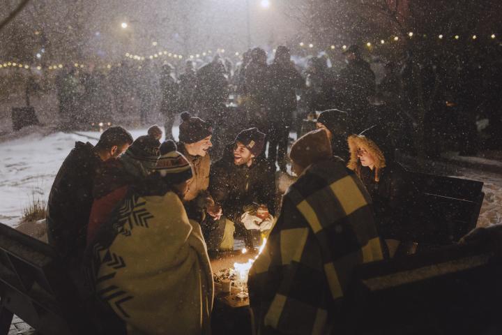 Great Northern Festival attendees sit around a fire during a previous year’s festival. In 2023, the cold-themed event will run from Jan. 25 to Feb. 5 around the Twin Cities. (Photo courtesy Great Northern Festival)