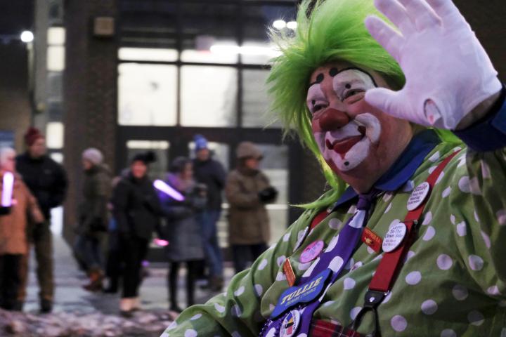 A clown rides around downtown St. Paul on a scooter in the torchlight parade on Feb. 4, 2023. The torchlight parade symbolizes Vulcanus Rex’s march on the ice castle to take the throne from King Boreas, a legend made into tradition every year at St. Paul’s winter carnival. (Bryson Rossell / Pioneer Press)